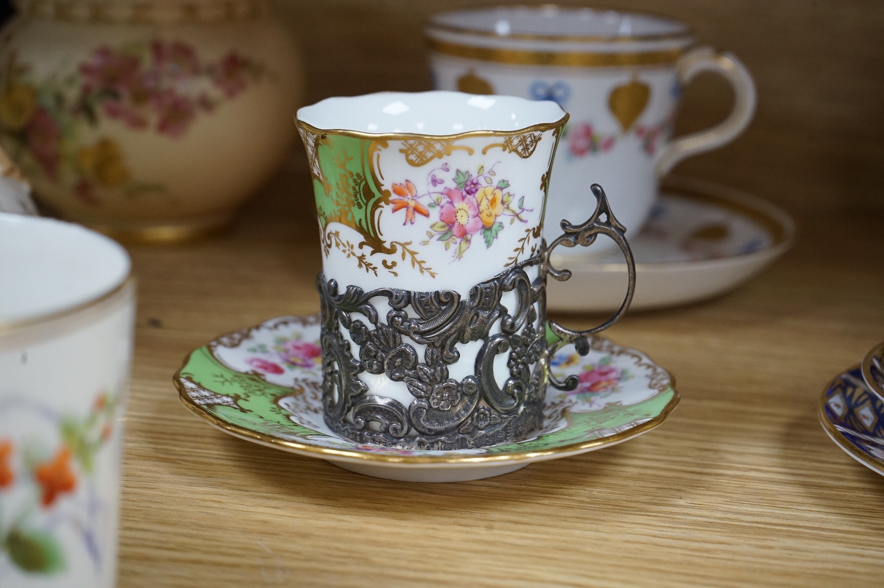 A Worcester butterfly handled cup and saucer and four other items, together with Royal Crown Derby, Dresden and Coalport items. (9). Tallest 13 cm